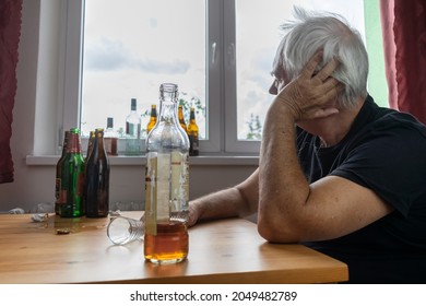 Old Senior Male Man Sit Next To Table Drink Alcohol Bottle At Home Sad Alone Alcoholism Signs And Symptoms Rehab Abuse And Recovery Problems