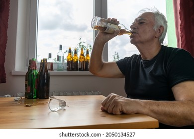 Old Senior Male Man Sit Next To Table Drink Alcohol Bottle At Home Sad Alone Alcoholism Signs And Symptoms Rehab Abuse And Recovery Problems