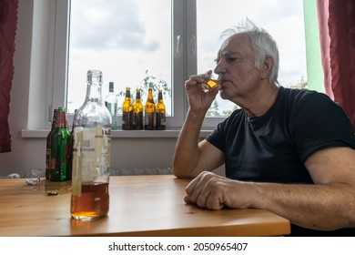 Old Senior Male Man Sit Next To Table Drink Alcohol Bottle At Home Sad Alone Alcoholism Signs And Symptoms Rehab Abuse And Recovery Problems