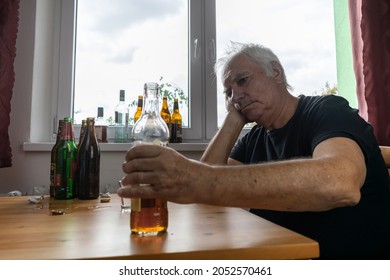 Old Senior Male Man Sit Next To Table Drink Alcohol Bottle At Home Sad Alone Alcoholism Signs And Symptoms Rehab Abuse And Recovery Problems