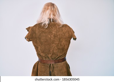 Old Senior Man With Grey Hair And Long Beard Wearing Viking Traditional Costume Standing Backwards Looking Away With Crossed Arms 