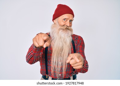 Old Senior Man With Grey Hair And Long Beard Wearing Hipster Look With Wool Cap Pointing Fingers To Camera With Happy And Funny Face. Good Energy And Vibes. 