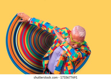 Old Senior Man Performing Dab Dance Moves. Concept About Lifestyle And Seniority. Isolated Man On Colored Background And Graphic Effects 