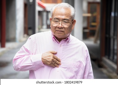 Old Senior Man With Reflux Sickness; Portrait Of Sick Stressed Retired Man With Acid Reflux, Gerd, Indigestion Symptoms; Asian Senior Man Health Care Model