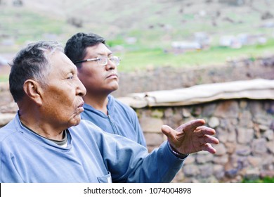 Old Serious Native American Father With His Son In The Countryside. 