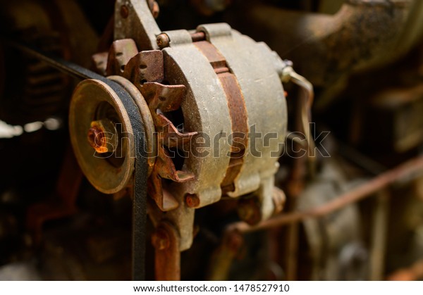 old serpentine drive belt for motor on alternator\
pulley on automobile engine