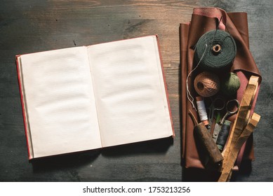 Old sewing accessory flat lay background. Sewing handbook template.