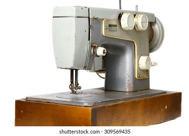 Old sewing machine isolated on white