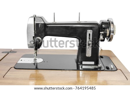 Old sewing machine isolated on white background.