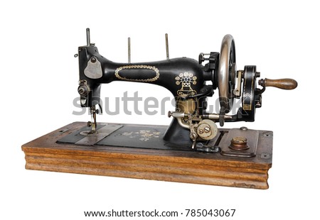 Old sewing machine isolated on white background.