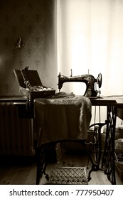 Old sewing machine in nostalgic interior. 