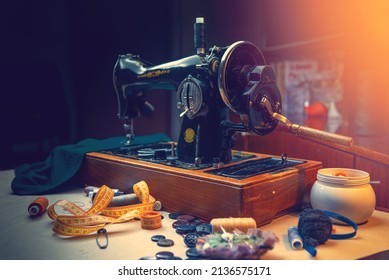 An Old Sewing Machine. Sewing On A Sewing Machine At Home. Equipment For Sewing And Repairing Clothes. Vintage Equipment For Seamstresses. Equipped Place For A Dressmaker.