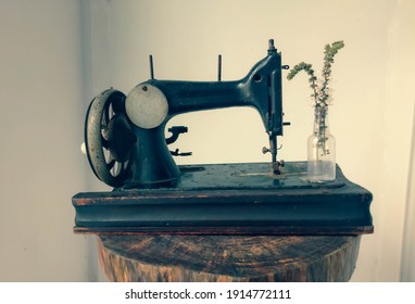 old sewing machine on vintage background 