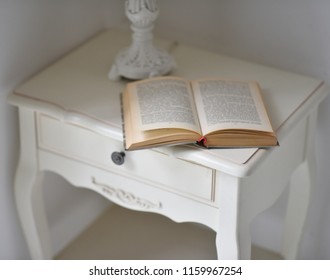 Old Shabby Book On A White Coffee Table