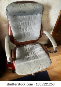 An Old Shabby Office Or Home Chair In A Room On A Cloudy Day.