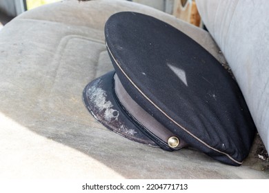 Old Shabby Postman Cap On A Car Seat As A Symbol Of Outdated Format Of Post Services