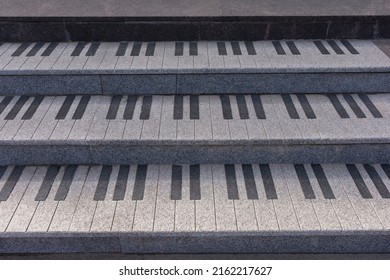 old shabby and worn outdoor steps in the form of piano keys made of marble