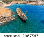Old ship wreck on sea coast. Blue sea water in summer. Paphos, Cyprus