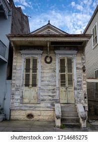 Old Shotgun House With Chipping Yellow Paint