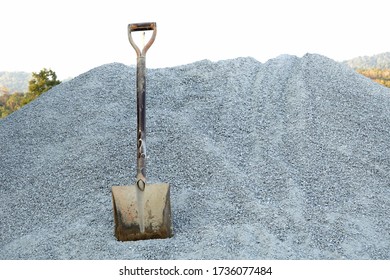            An Old Shovel In The Gray Stone Pile.           