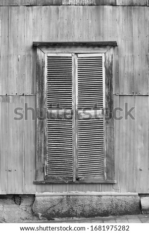 Similar – Two windows with closed shutters