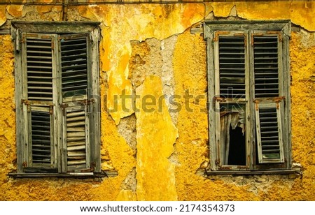 Old shutters of an abandoned house. Window shutters of old abandoned house