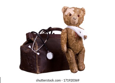 Old Sick Teddybear On Suitcase