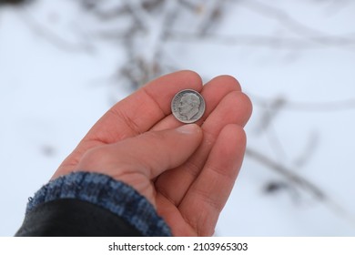 Old Silver Coin One Dime In Hand