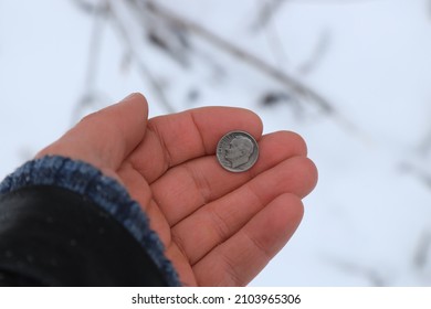 Old Silver Coin One Dime In Hand