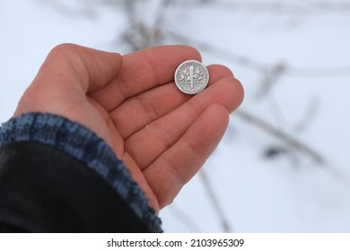 Old Silver Coin One Dime In Hand