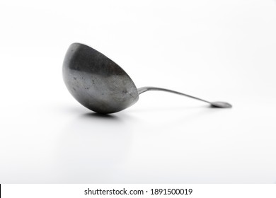 Old Silver Ladle Against A White Background