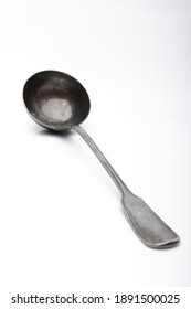 Old Silver Ladle Against A White Background