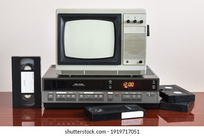 Old Silver Vintage TV With VCR On Wallpaper Background.