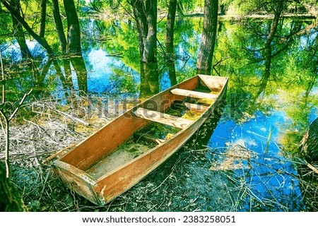 Old simple wooden one oar flat-bottomed boat design for inland waters. It resembles coffin and in such boats ancestors of Slavs were buried, Charon carrier. Middle course of Don River, Russia