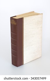 Old Single Book Standing Upright On White Background