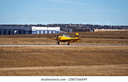 An Old Single Engine Trainer Airplane Landing on a Runway