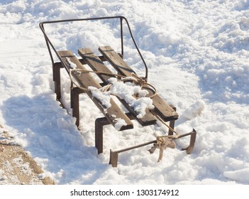 Old sled on snow - Shutterstock ID 1303174912