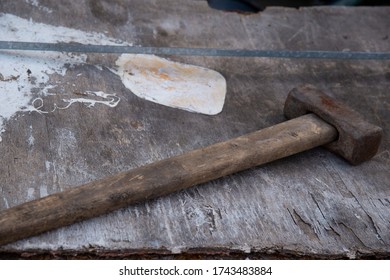 Old Sledgehammer On An Old Wooden Table.