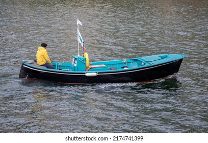 Old Small Boat Entering Port