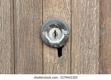 Old Small Round Key Hole On An Antique Worn Wooden Door Up Close, Keyhole, Simple Lock Front View, Object Closeup, Frontal Shot, Doors Part Detail, Round Lock Mechanism Macro, Nobody, No People