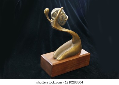 Old small Statue in bronze. a fantastic figure made from bronze on black background. Antique bronze culture concept. brozen small statue or bronze sculpture - Powered by Shutterstock