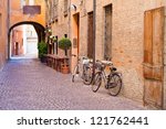 old small stone medieval street in historical center of Ferrara, Italy