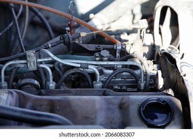 Old Small Used Car Diesel Engine Fiel System With Mechanical Fuel Injection Pump Rail System Drive Closeup On Opened Filling Cap Background