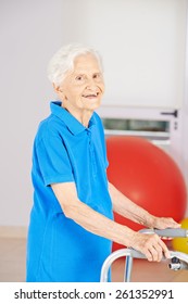 Old smiling senior woman going with walker to physiotherapy