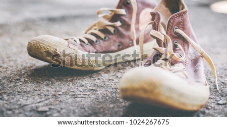 old sneaker with copy space for text.stylish and fashion accessories men wear shoes concept.vintage tone