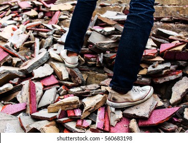 Old Sneakers On A Pile Of Bricks