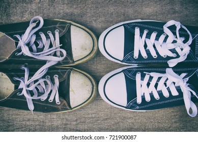 Old Sneakers Vs New Sneakers, Canvas Shoes On A Wooden Board. Trendy Footwear. Top View.