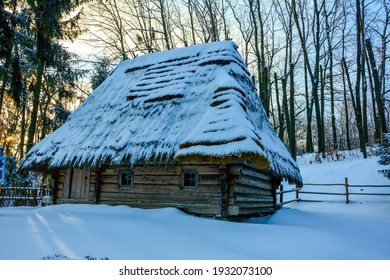 old snow-covered Ukrainian house in winter.Museum in Lviv Shevchenko guy.Museum of Folk Architecture and Everyday Life of Ukraine.