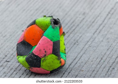 An Old Soccer Ball With Dog Bite Marks.