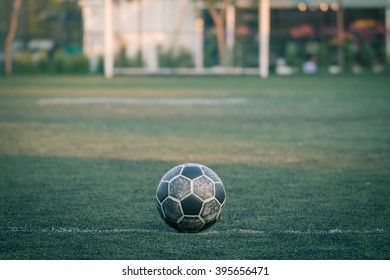 Old Soccer Ball On Soccer Field